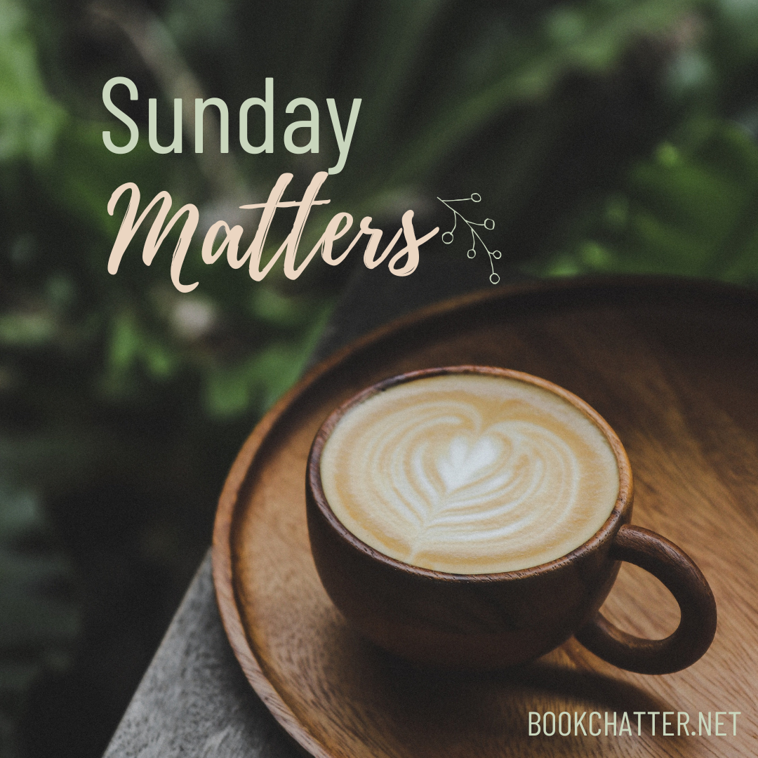Sunday Matters, a latte on a wooden tray against greenery.