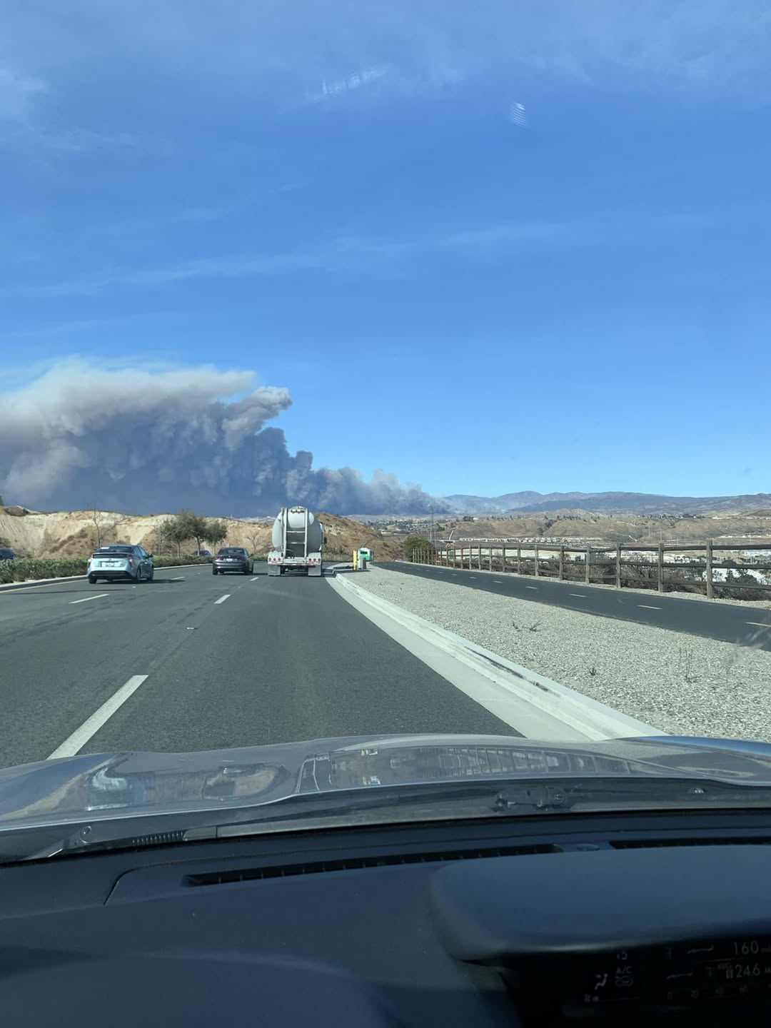On the road, plume of thick smoke from the Hughes fire.